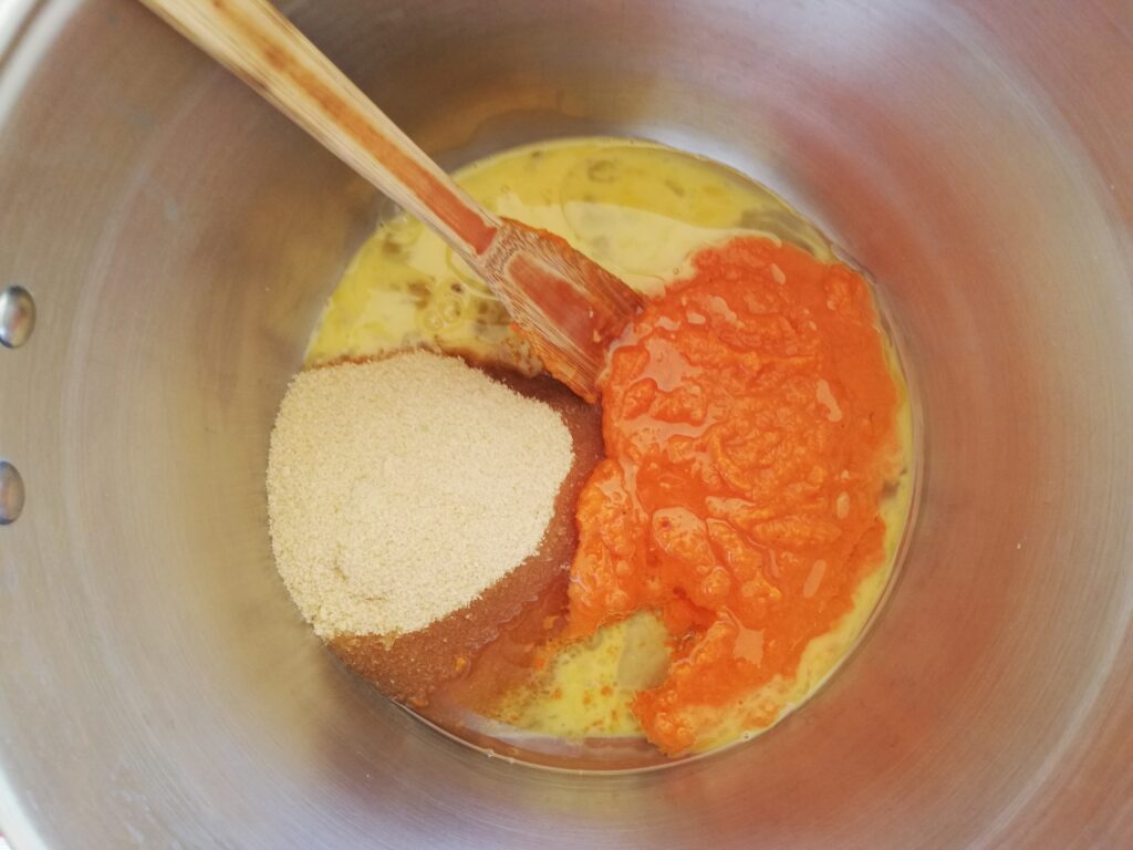 metal bowl with sugar pumpkin puree oil and eggs
