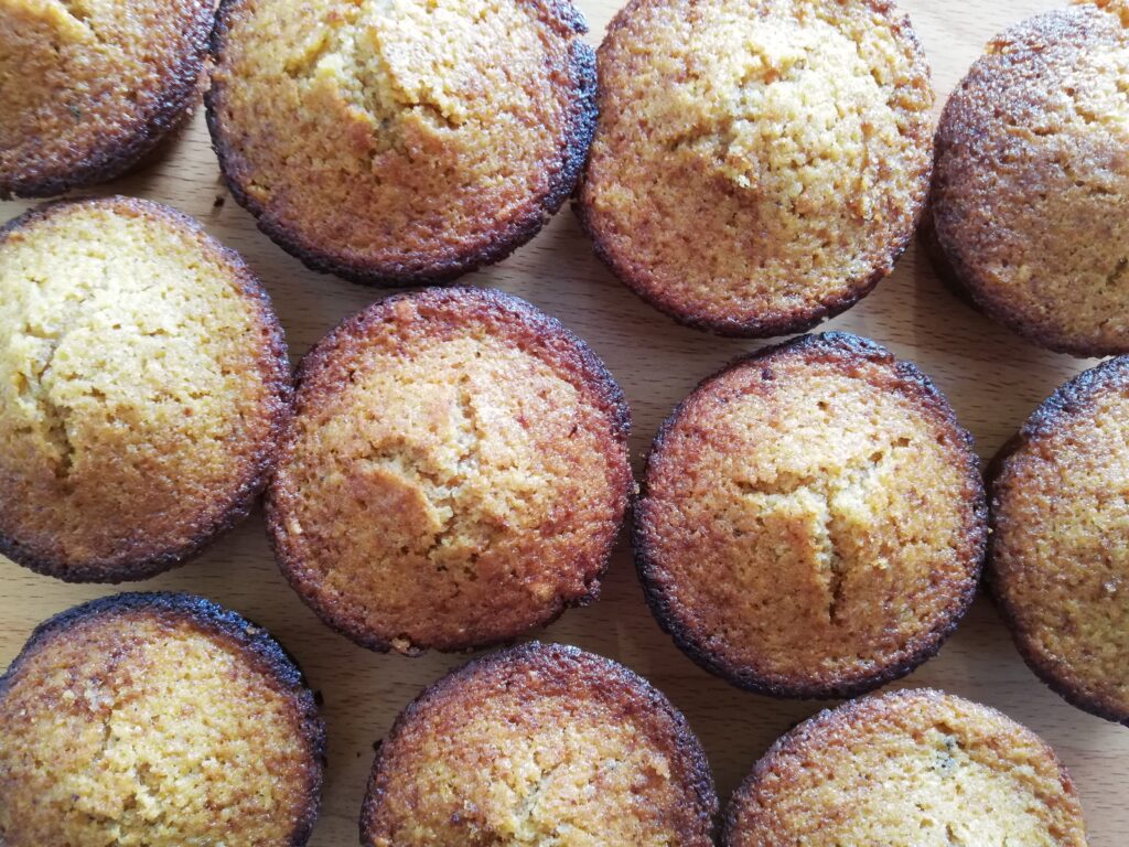 sourdough pumpkin muffins on a wooden table