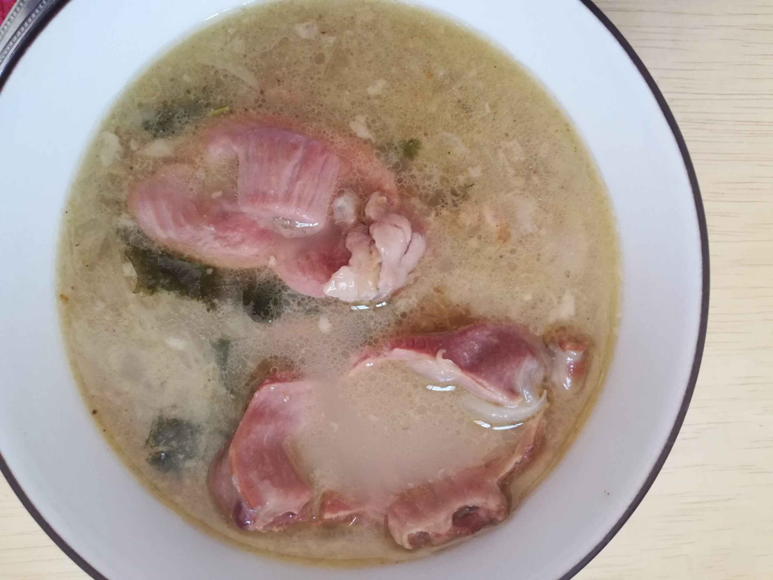 gizzards soup in a white bowl