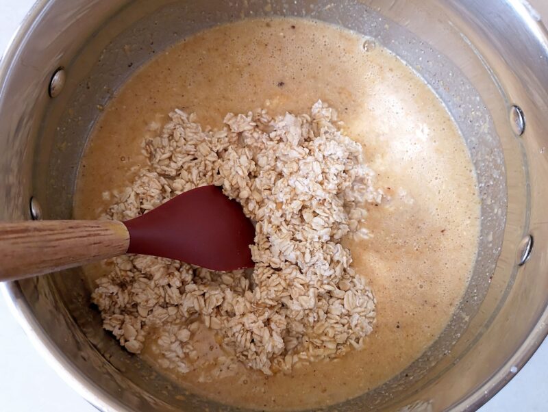 Adding soaked oats to wet ingredients for pumpkin baked oatmeal