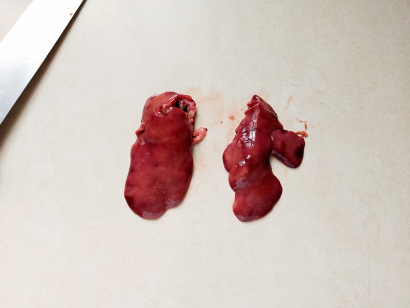 Cutting chicken liver in half