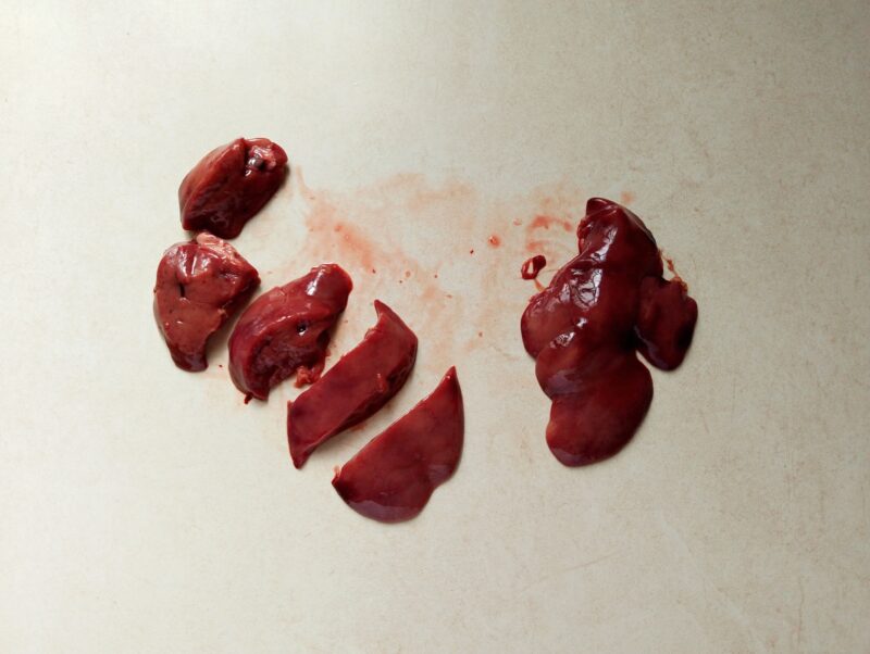 Slicing chicken livers to make them ready for cooking