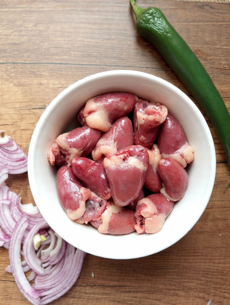 How to prepare chicken hearts: hearts in a bowl, ready for cooking