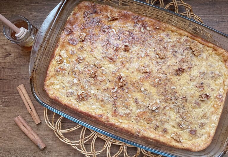 Pumpkin baked oatmeal in baking dish on wooden table