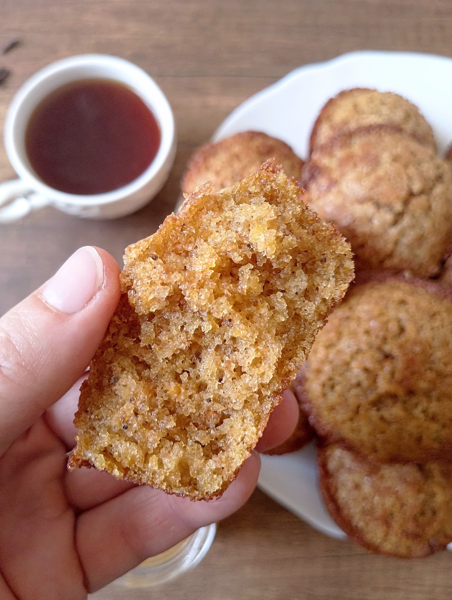 Hand holding sourdough pumpkin muffin