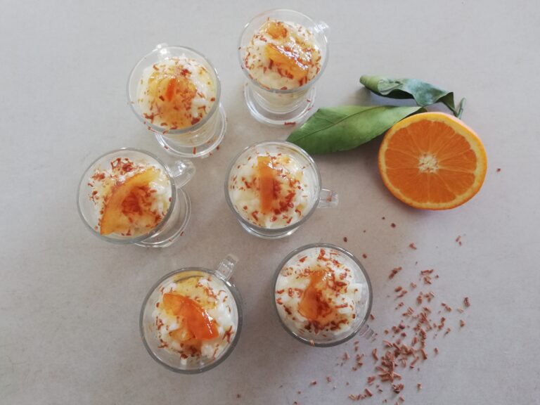 orange and chocolate rice pudding in glass cups