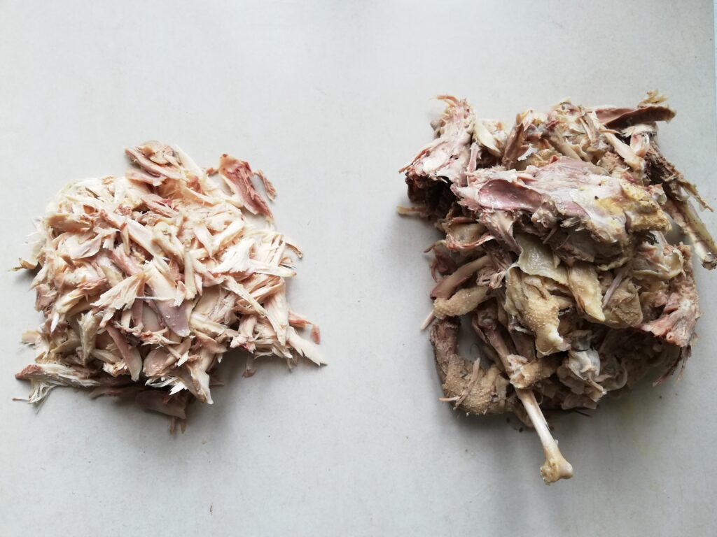 shredded chicken meat on the left chicken skin and bones on the right