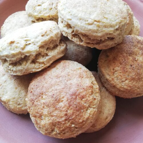 sourdough discard whole wheat biscuits on a clay plate