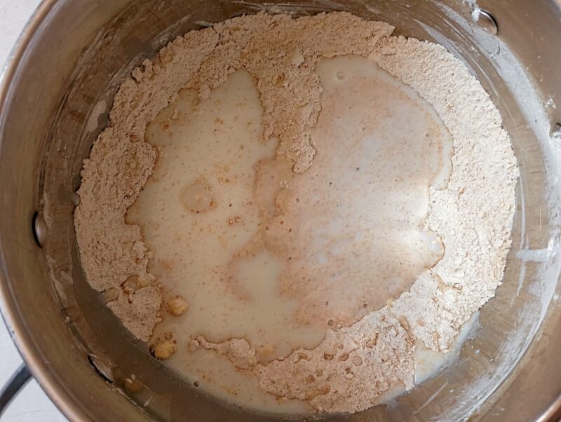 Mixing wet and dry ingredients for sourdough biscuits
