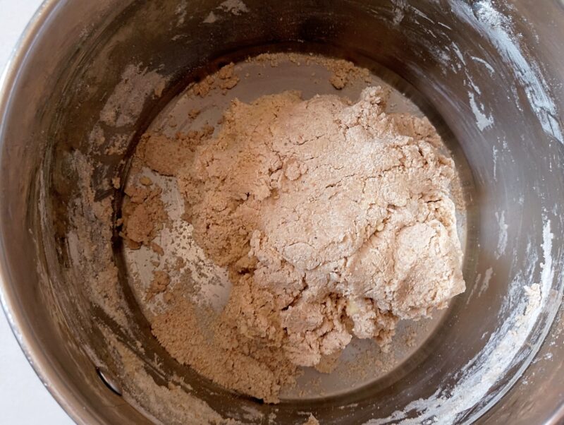 Mixing biscuit ingredients until shaggy dough forms