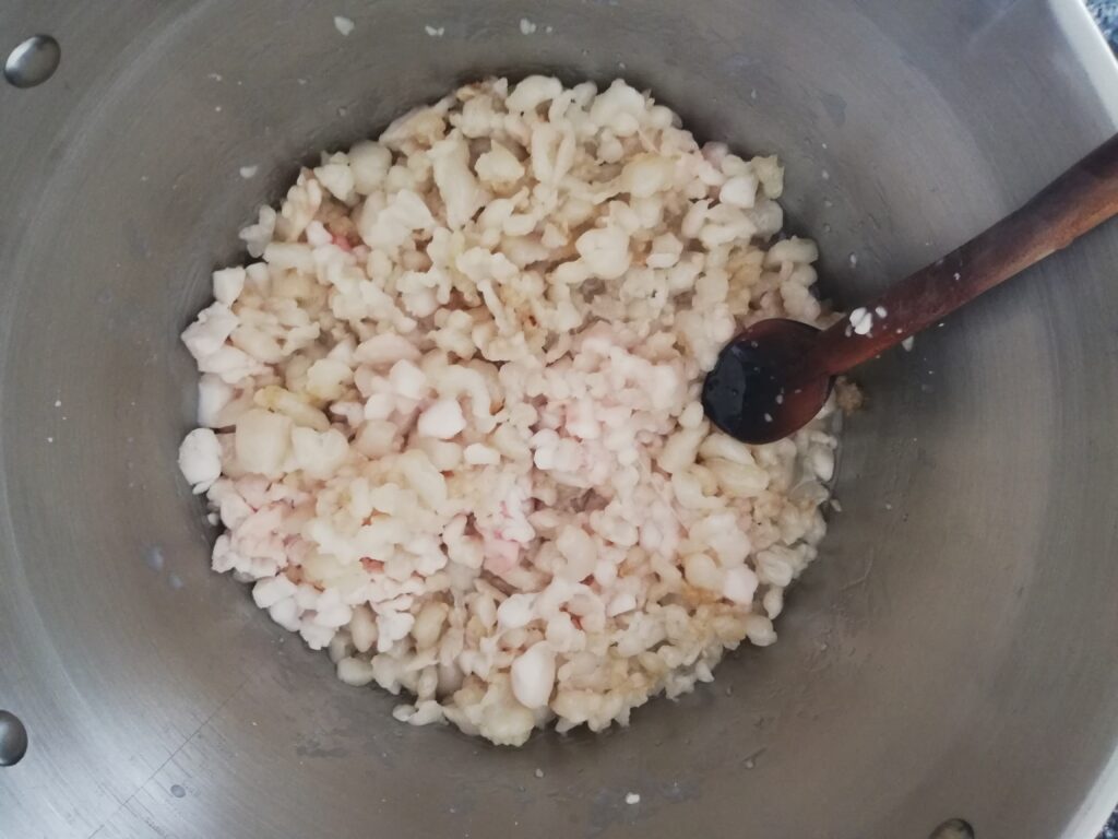 chopped fat starting to melt in a metal pot