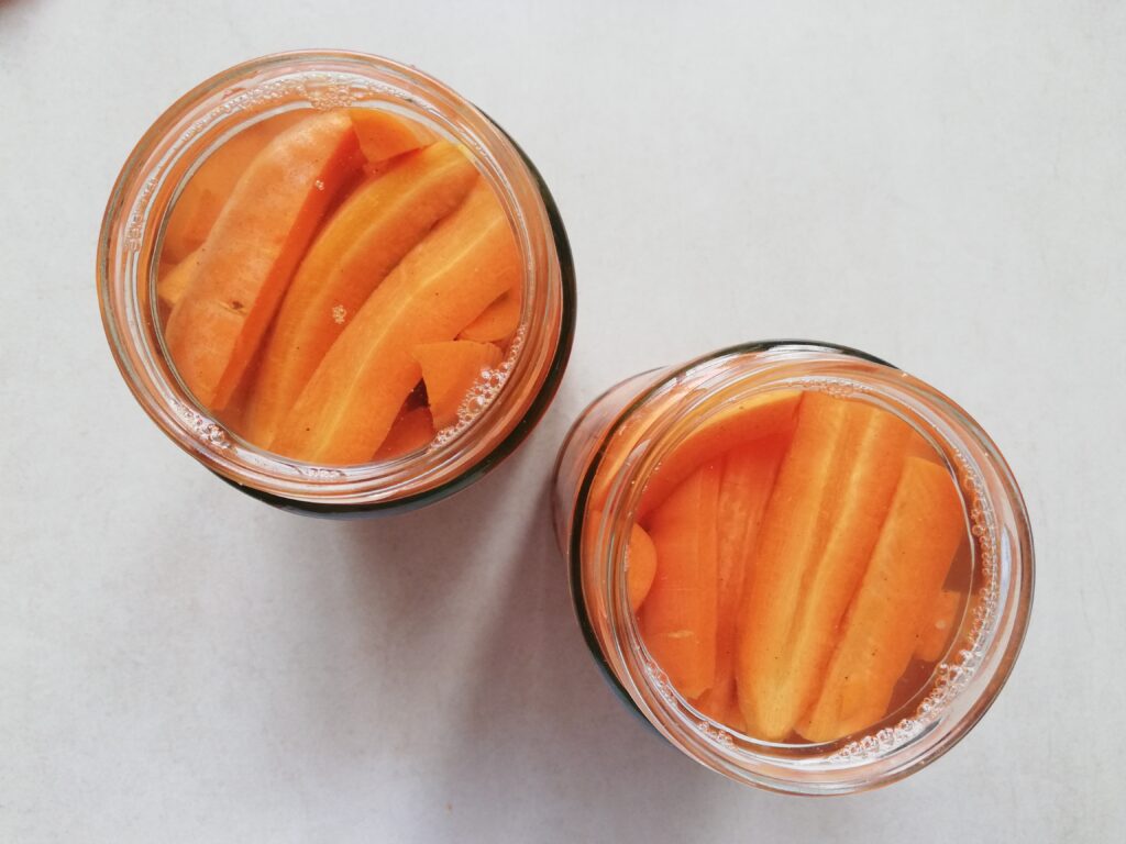 two jars with lacto fermented carrots with ginger 