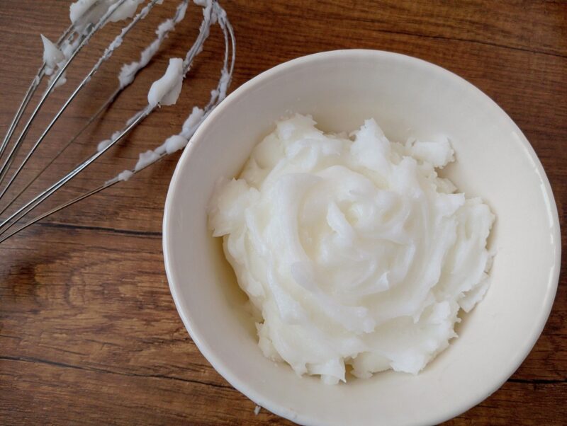 Whipped tallow in bowl with a whisk on the side