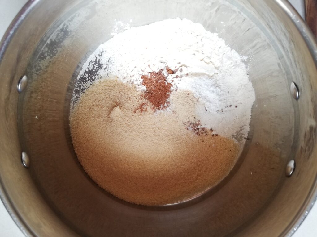brown sugar flour baking powder salt and spices in a large metal mixing bowl