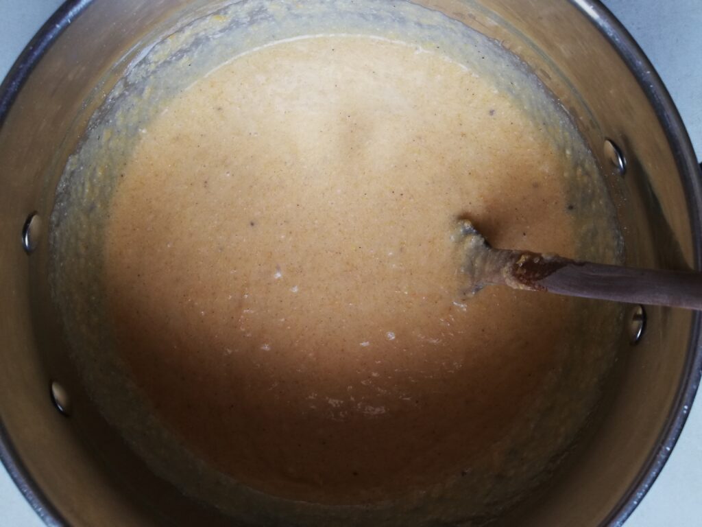 crustless pumpkin pie batter in a metal mixing bowl