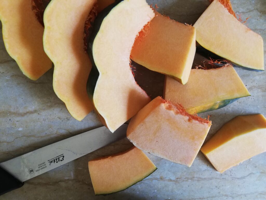 slices of raw pumpkin and a kitchen knife