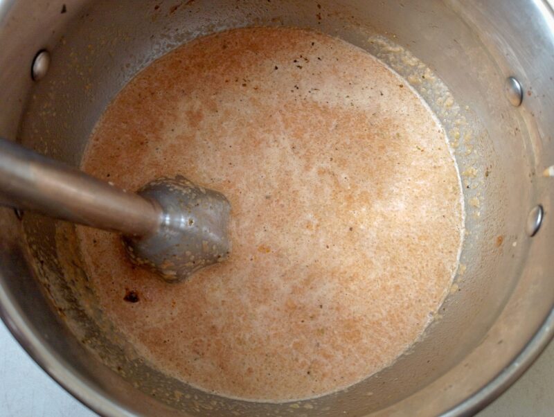 Blending soup base with stick blender