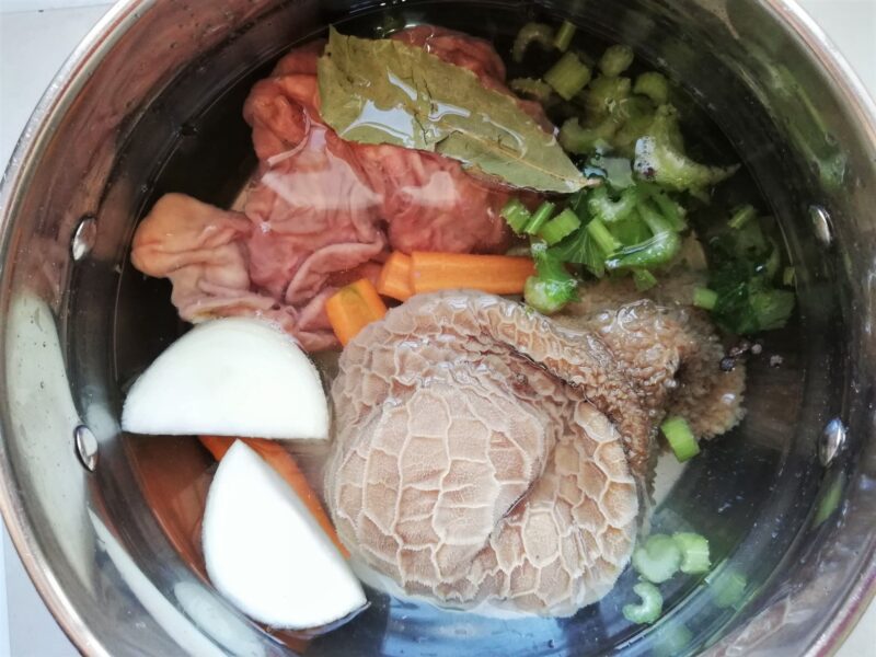 Tripe. onion, celery, carrots, and spices in pot, ready for cooking