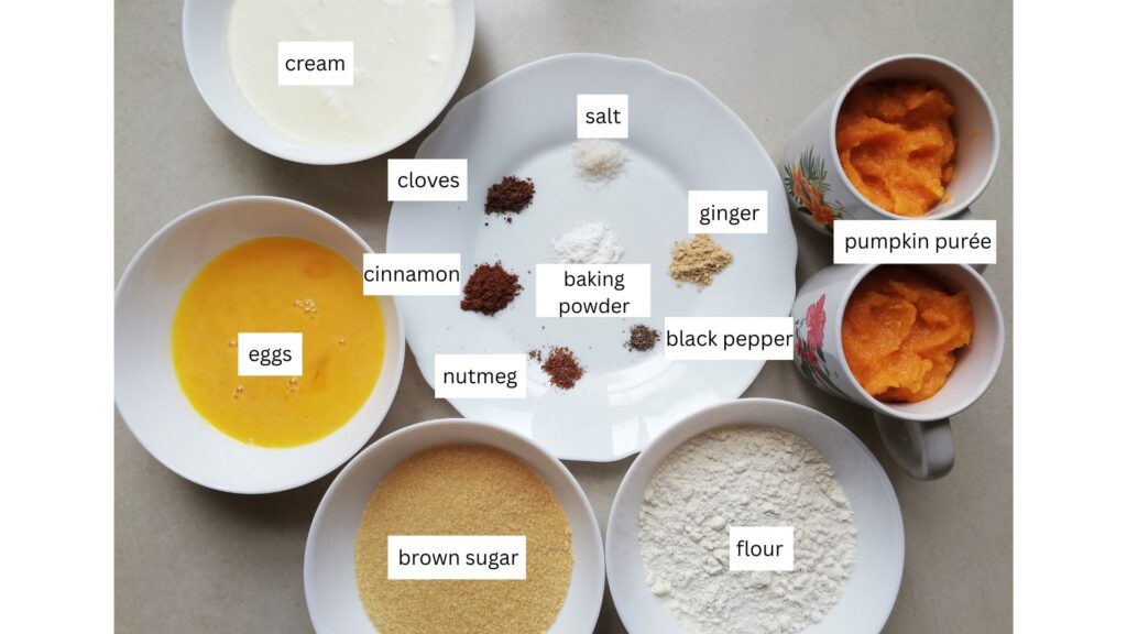 a bowl of cream two cups of pumpkin puree a bowl of white flour a bowl of brown sugar a bowl with whisked eggs and a plate with little heaps of salt ginger black pepper baking powder nutmeg cinnamon and cloves