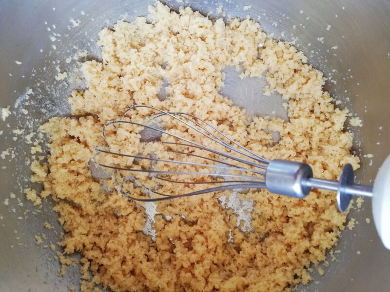 Creaming together butter and brown sugar with a whisk