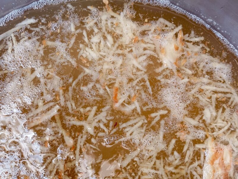 Ginger bug soda with lots of bubbles on the surface, ready for bottling