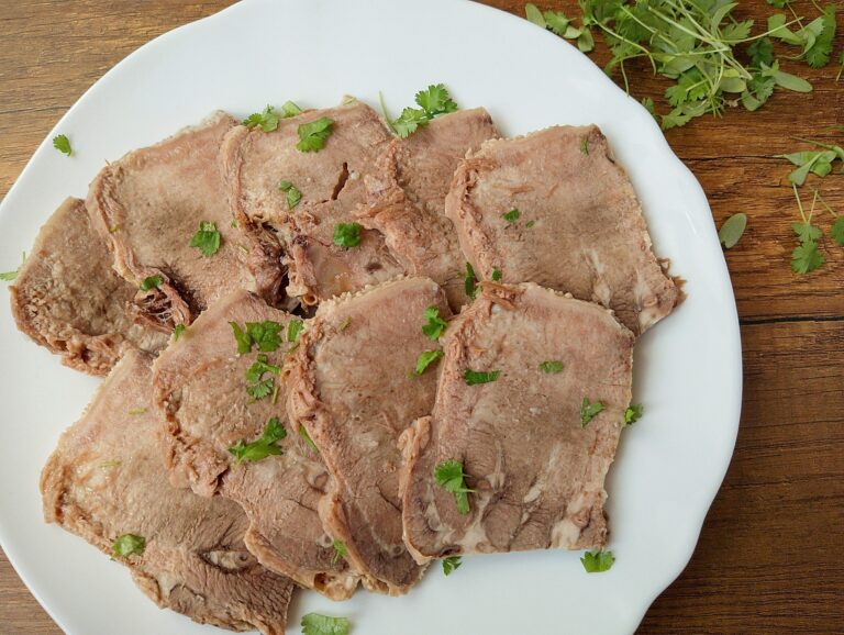 How to cook beef tongue: sliced beef tongue on serving plate