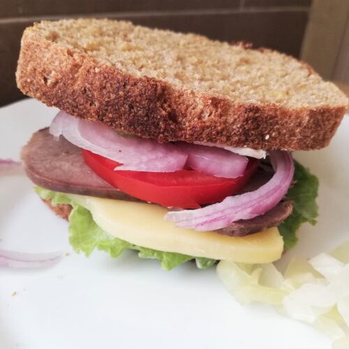 How to cook beef tongue: beef tongue sandwich on a plate