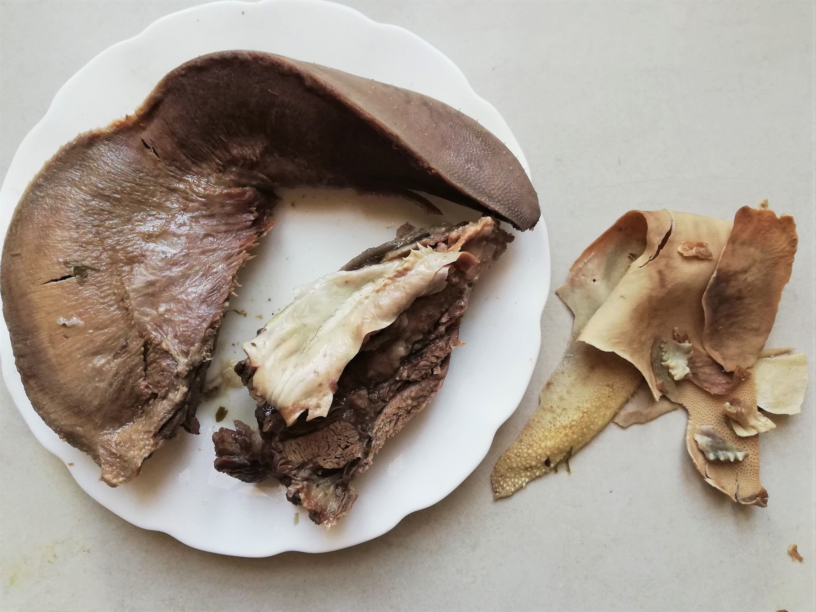Peeled beef tongue on a plate