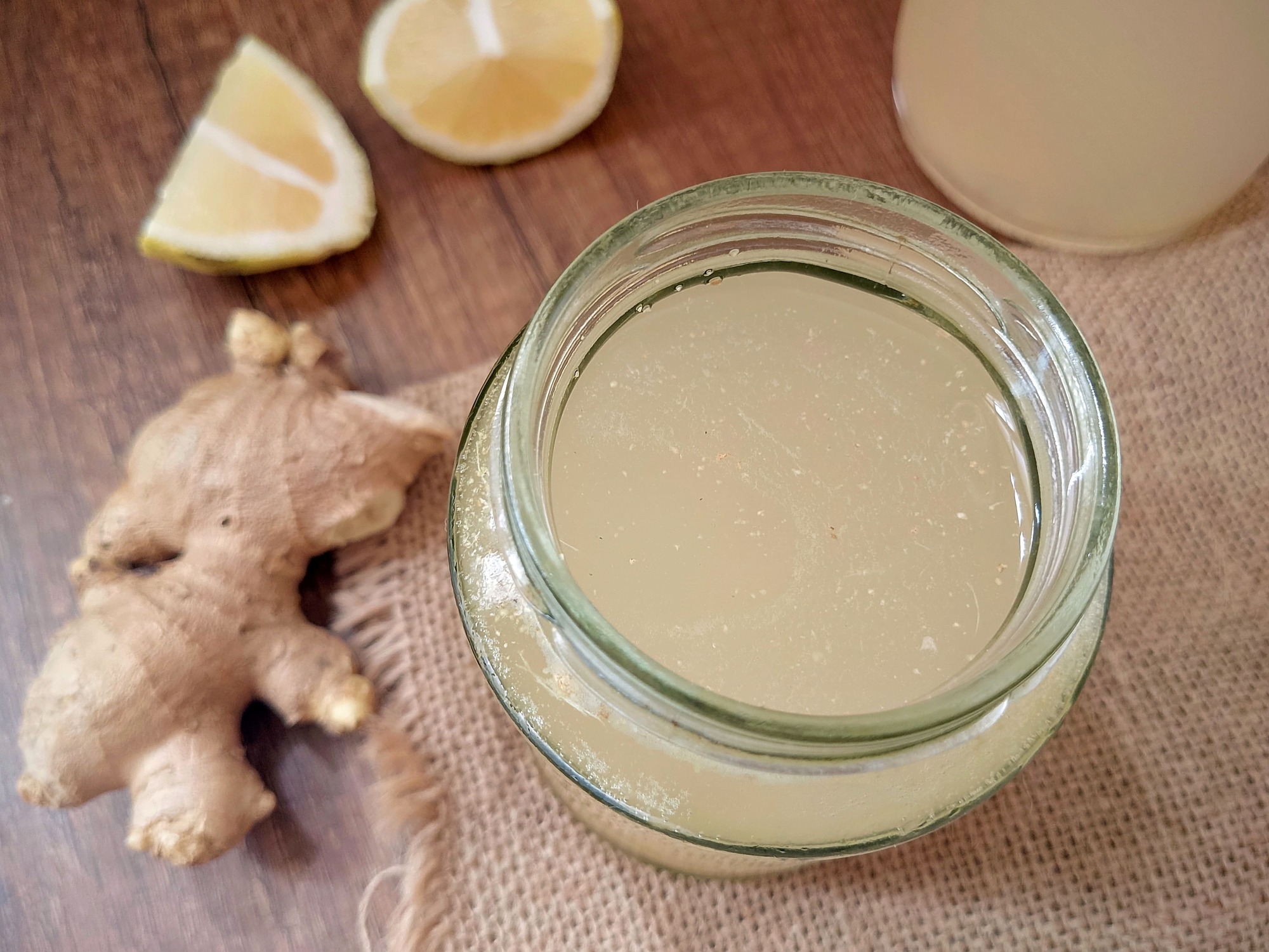 Ginger bug starter in jar on burlap