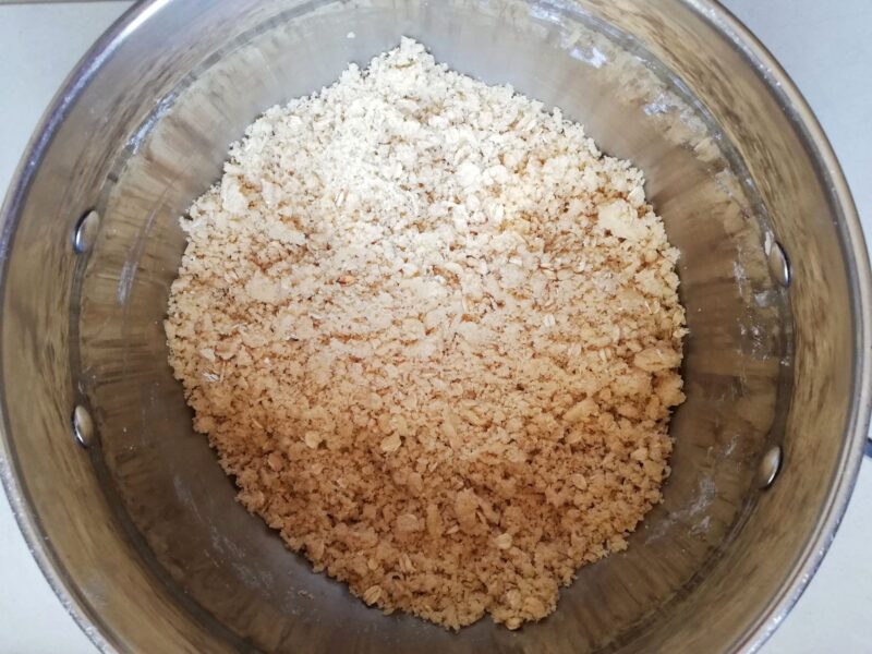 Mixing streusel topping in bowl