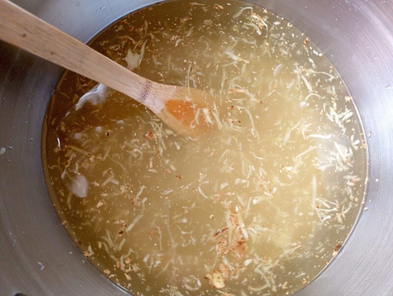 Mixing ingredients for ginger bug soda in bowl