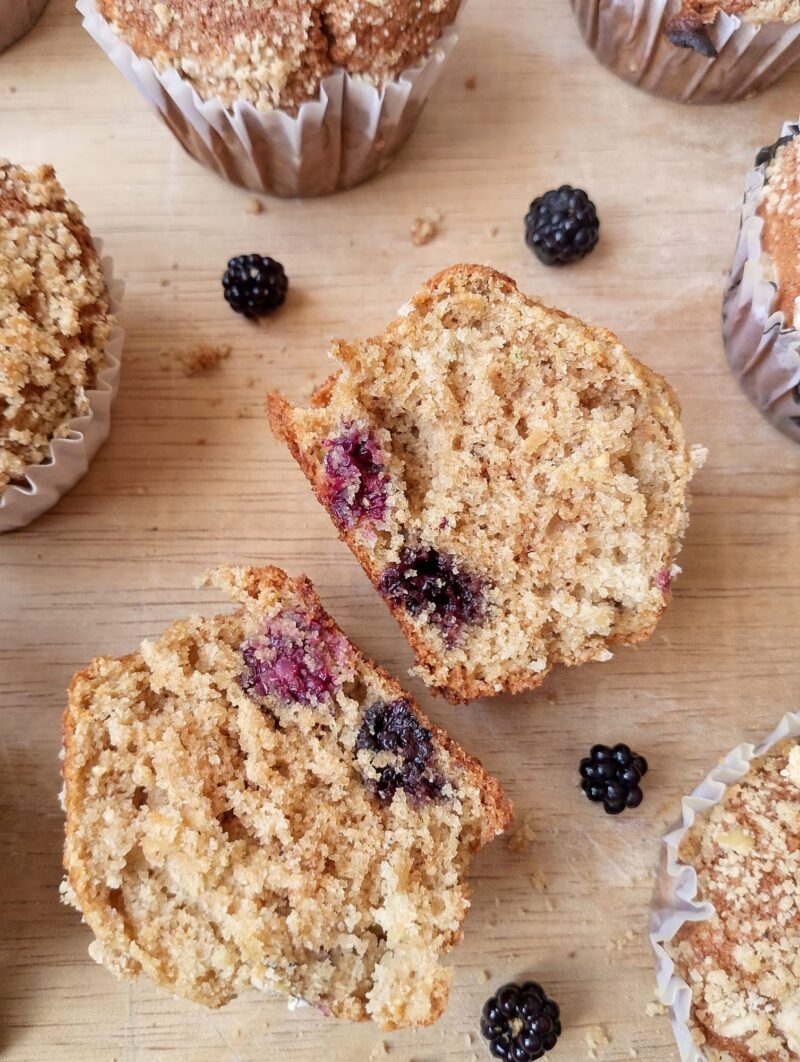 Sourdough applesauce blackberry muffin cut in half to show texture