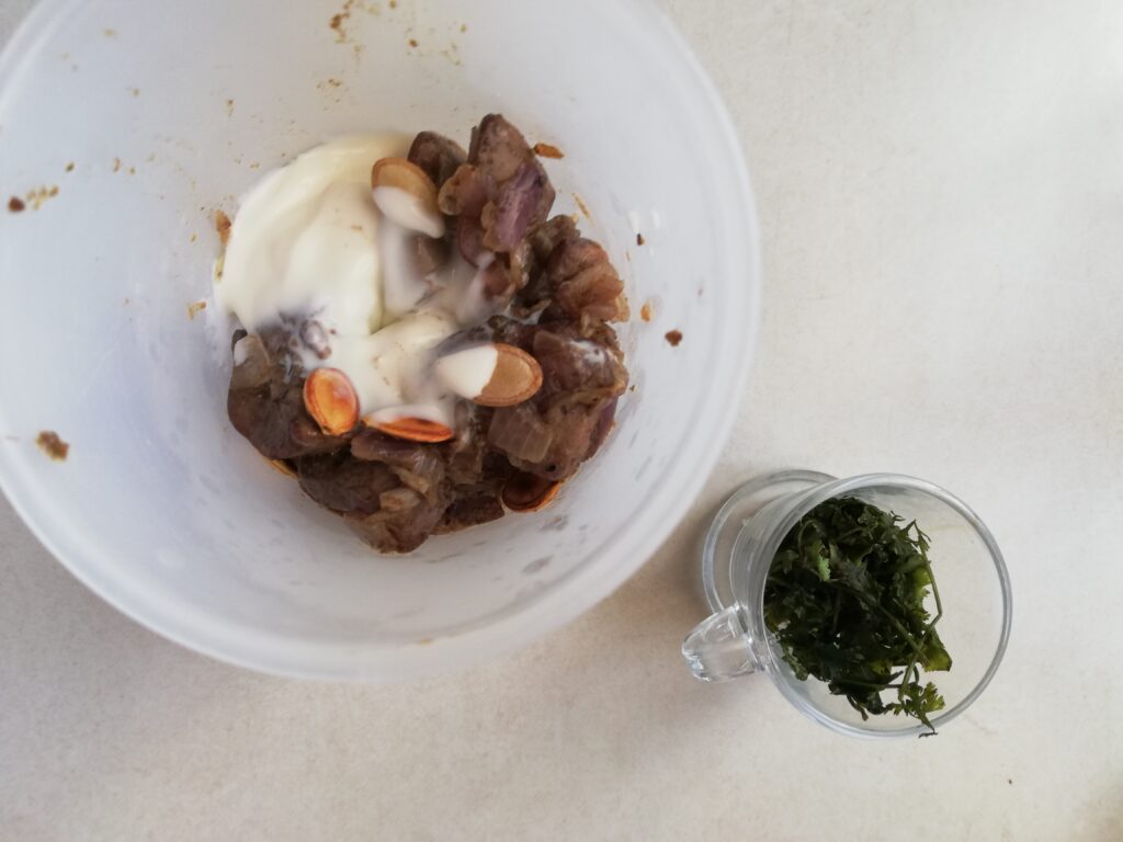 Blending chicken liver pate in a plastic measuring cup
