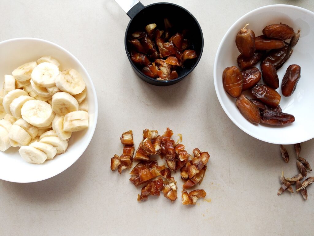 Slicing bananas and chopping dates for the bread and butter pudding