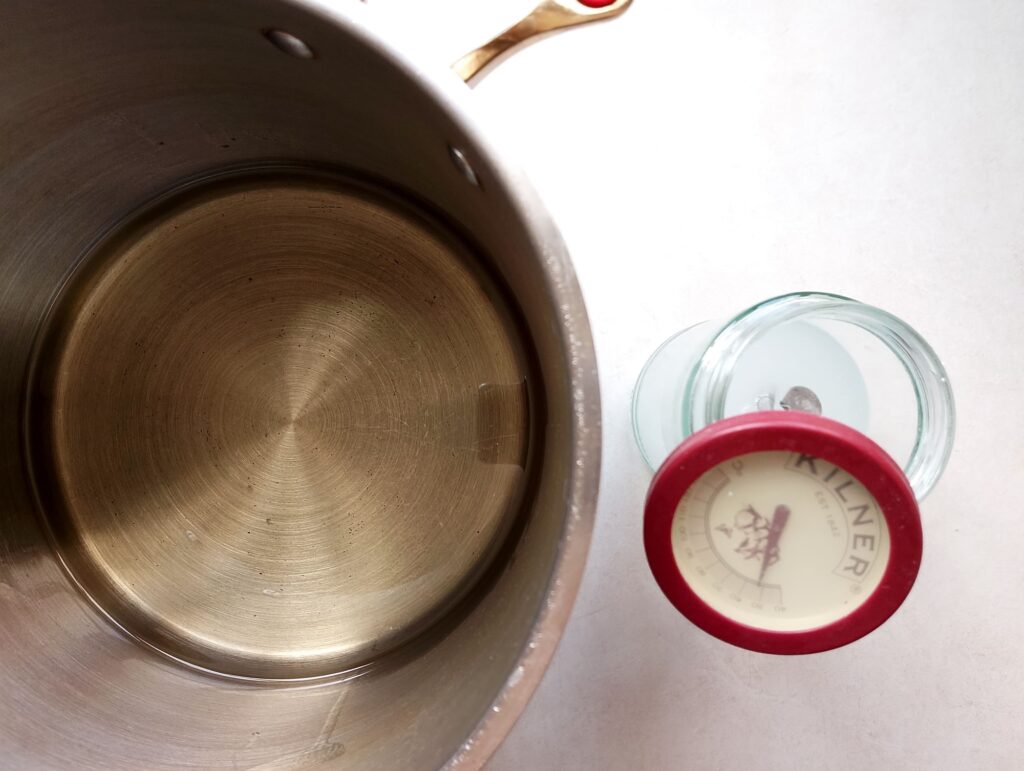 Waiting for the coconut oil and the lye solution to cool and equalize in temperature