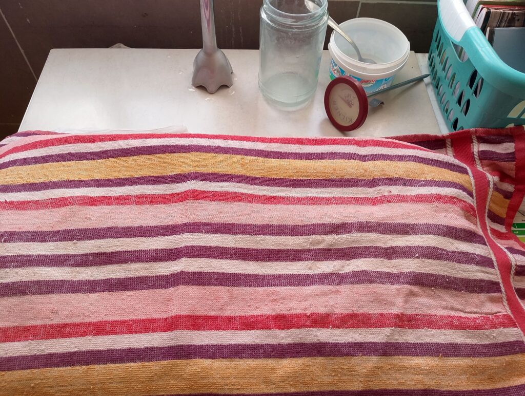 Insulating the freshly made cold process coconut oil soap with a towel