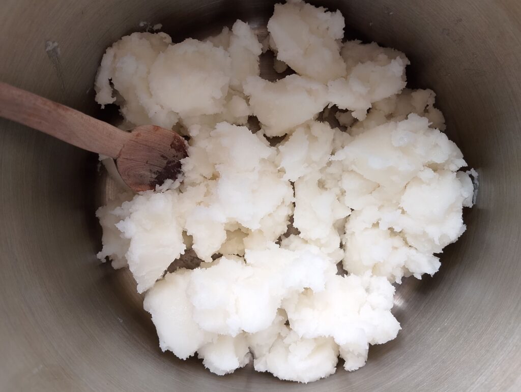 Melting coconut oil in a stainless steel pot
