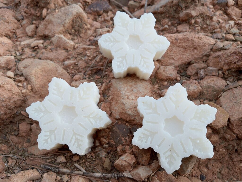 Cold process coconut oil soap bard on background of rocks