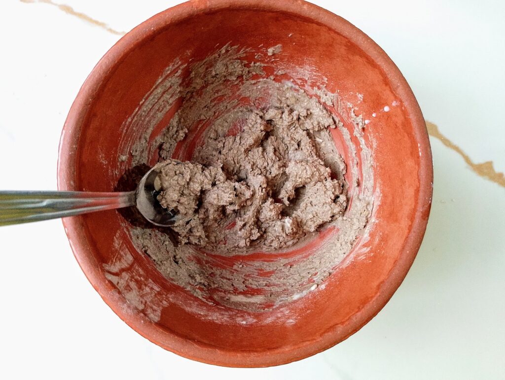 Mixing the wet and dry ingredients of the DIY face mask together
