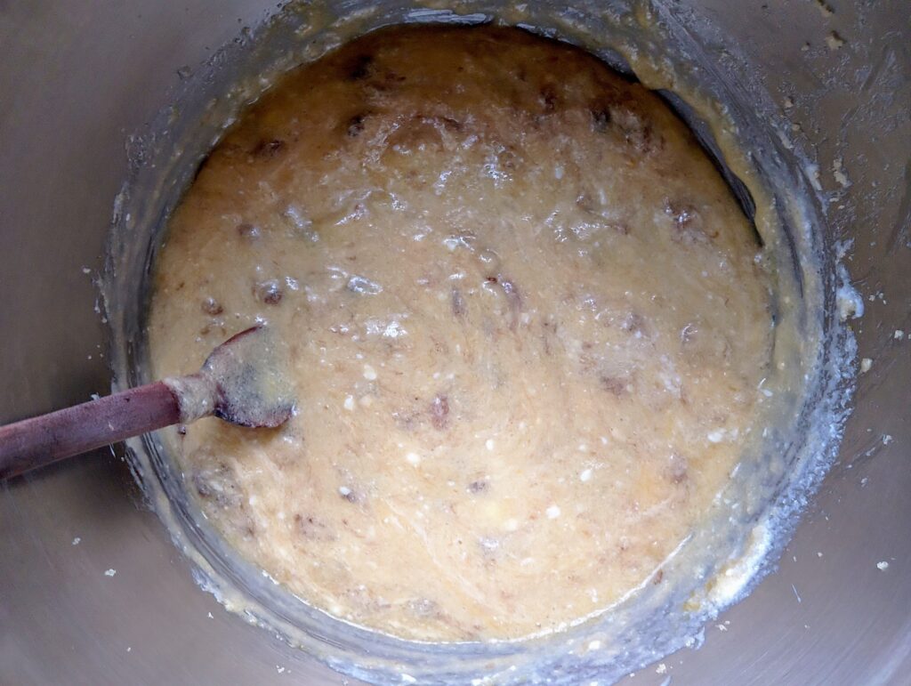 Adding mashed bananas, kefir, and sourdough discard into sourdough banana bread batter