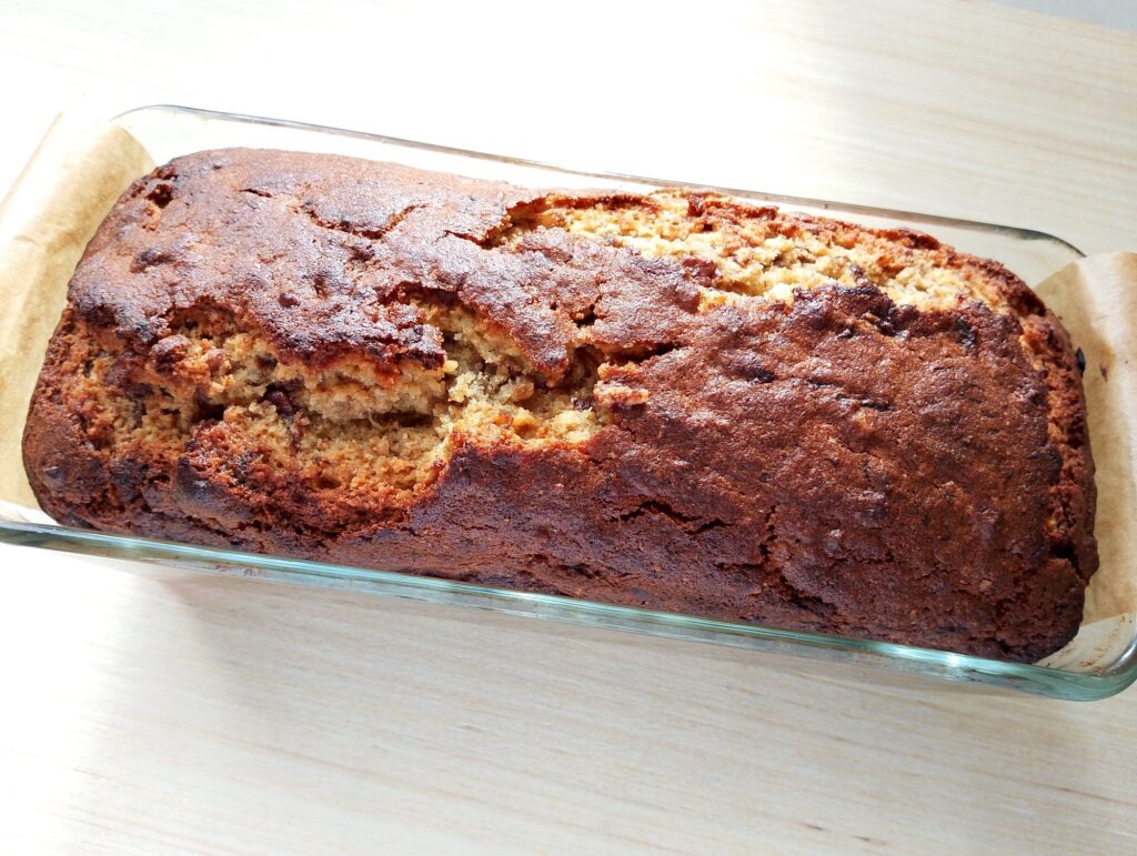 Freshly baked sourdough discard banana bread cooling on the table