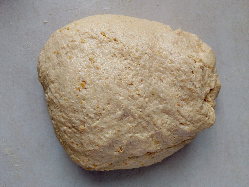 Kneading the butter into the dough to make it smooth