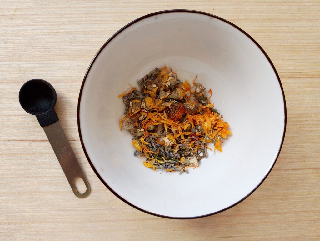 Ingredients for diy herbal steam facial mixed in a small bowl