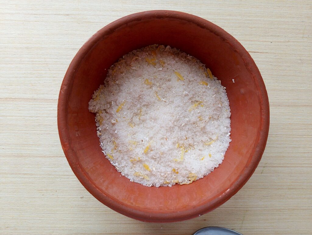 Mixing the dry ingredients for the foot scrub in a bowl