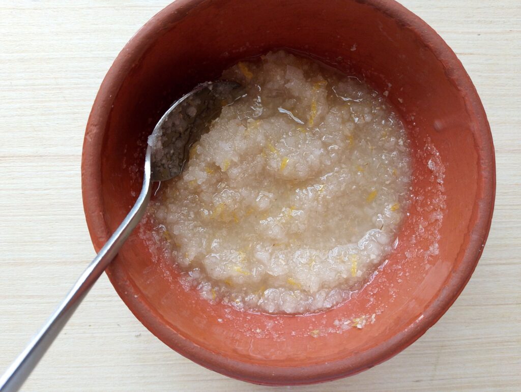 Mixing oils into the dry ingredients for the diy foot scrub
