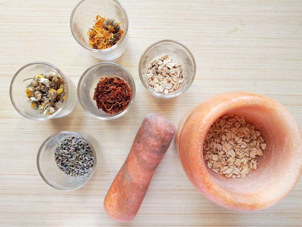 Grinding herbs and oats in a pestle