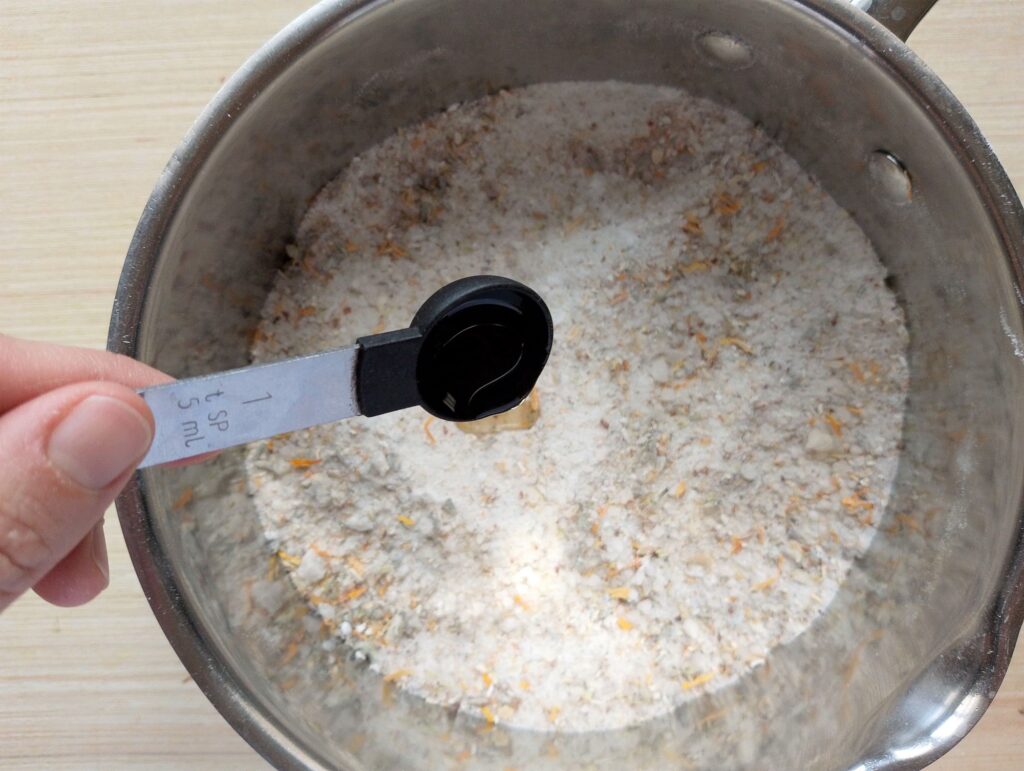 Adding lavender essential oil mixed in carrier oil to the bath salts mixture