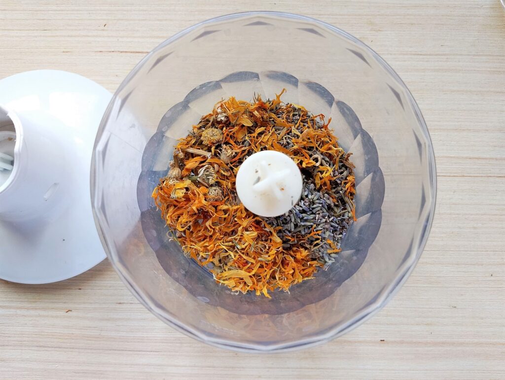 Chopping dried herbs in a mini food processor