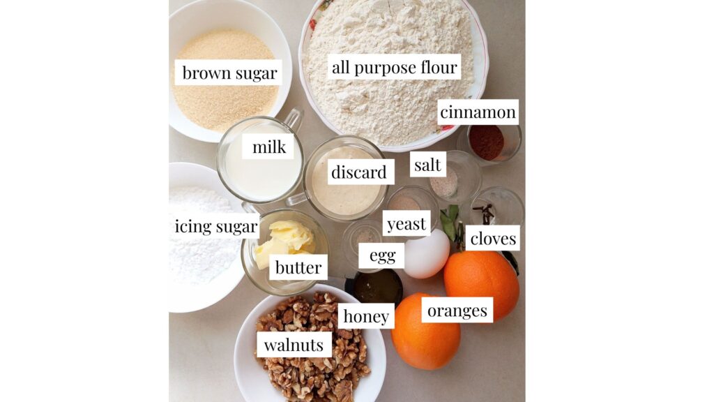 Ingredients for sourdough discard orange cinnamon rolls collected on the counter