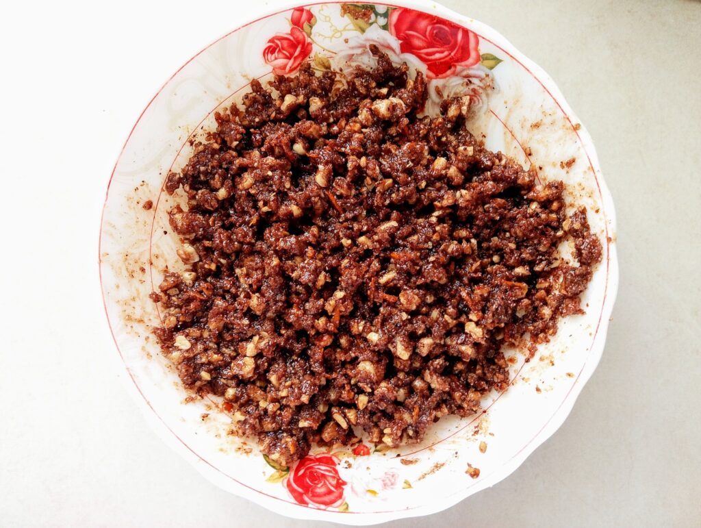 Mixing the cinnamon roll filling ingredients in a bowl